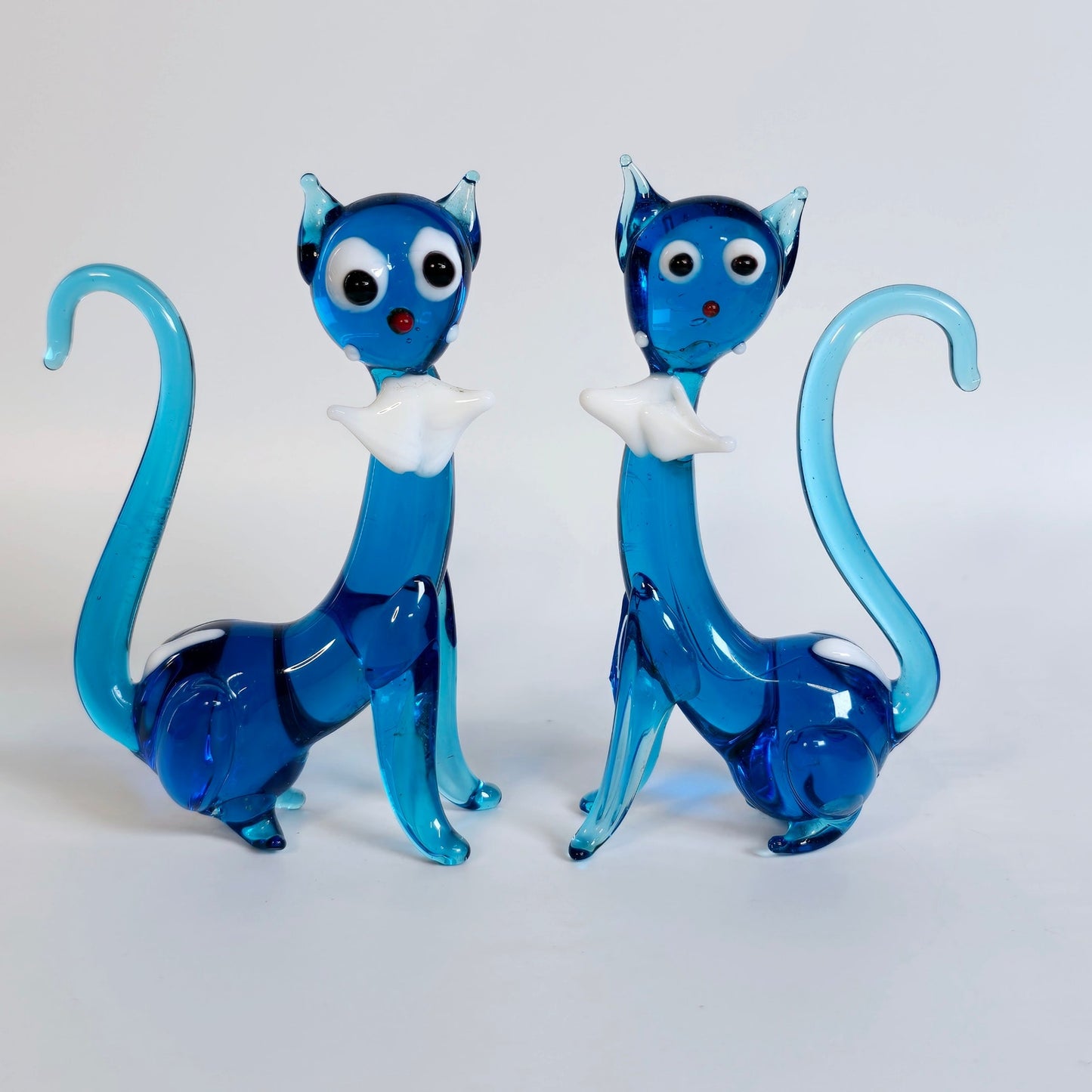 Handblown Pair of Slender Sitting Art Glass Siamese Cats with Bows, Blue Stretch Glass Cats
