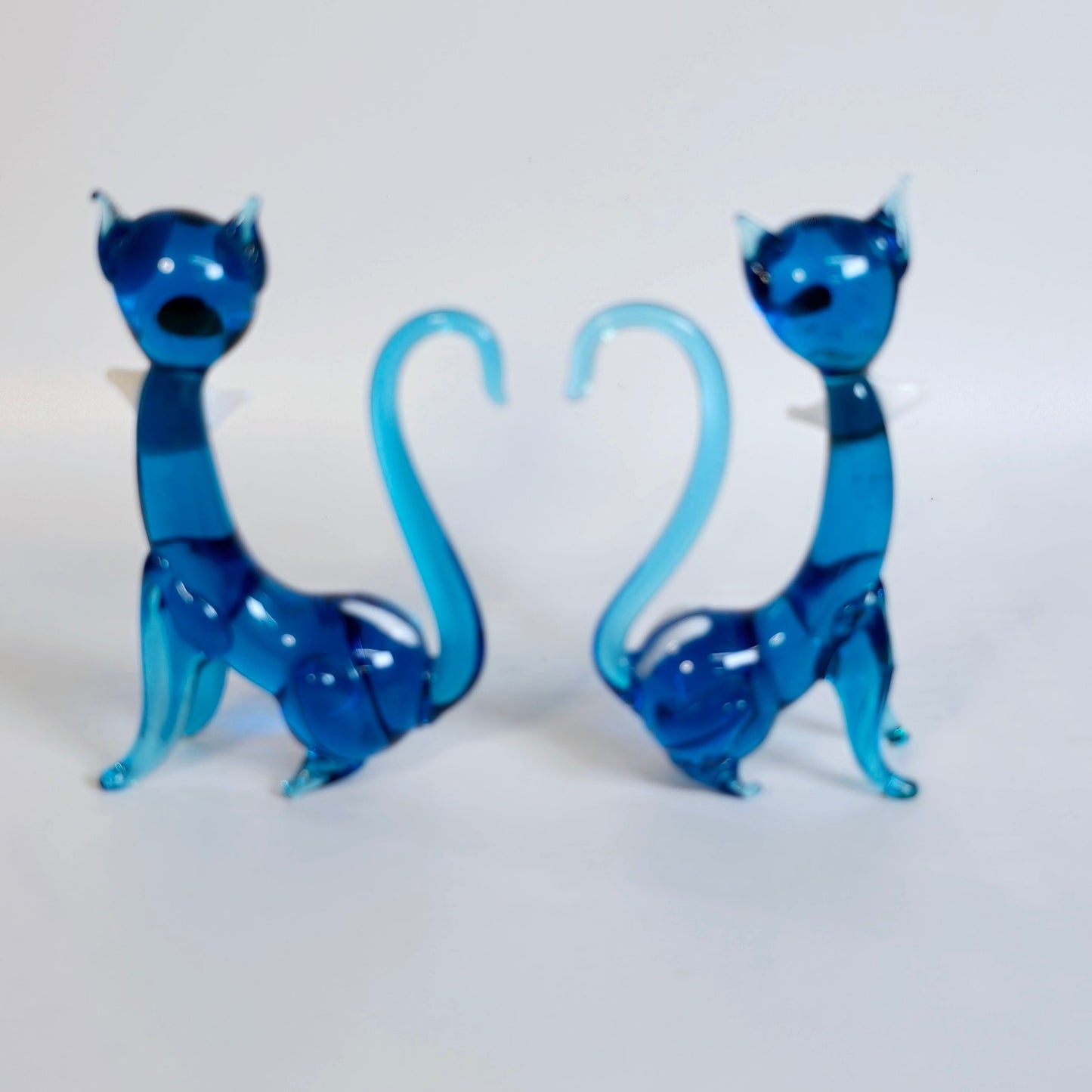 Handblown Pair of Slender Sitting Art Glass Siamese Cats with Bows, Blue Stretch Glass Cats