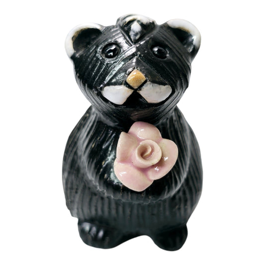 Artesania Rinconada Adorable Skunk Holding Pink Flower Skunk Figurine