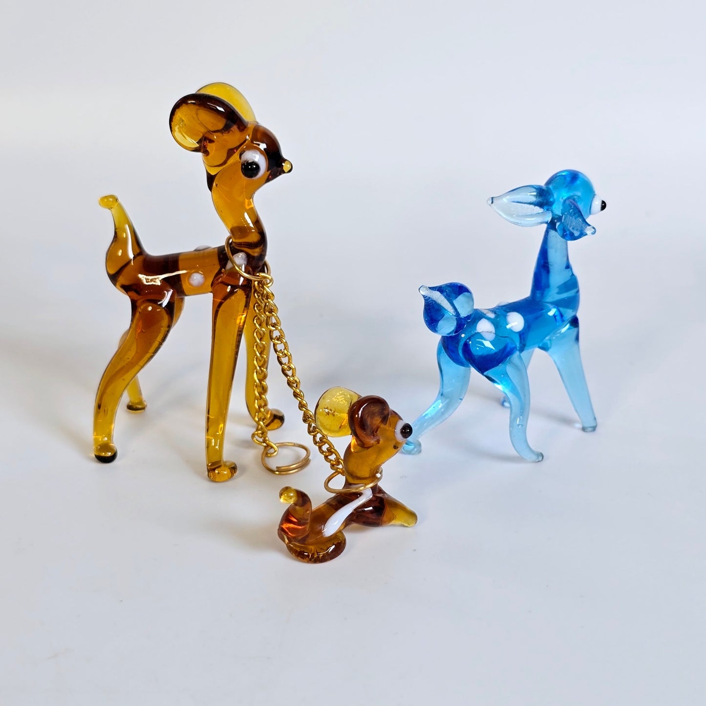 Set of 3 Glass Deers, Doe and two Fawns, Deer Mother Chained to one Baby Deer