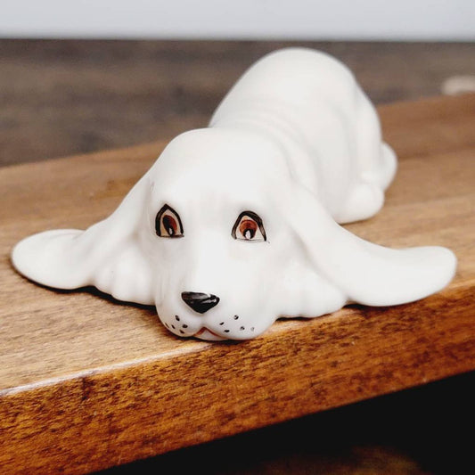 White Ceramic Hound Dog Figurine SDAC Hand Painted Eyes Nicola Lying Down 3.5"