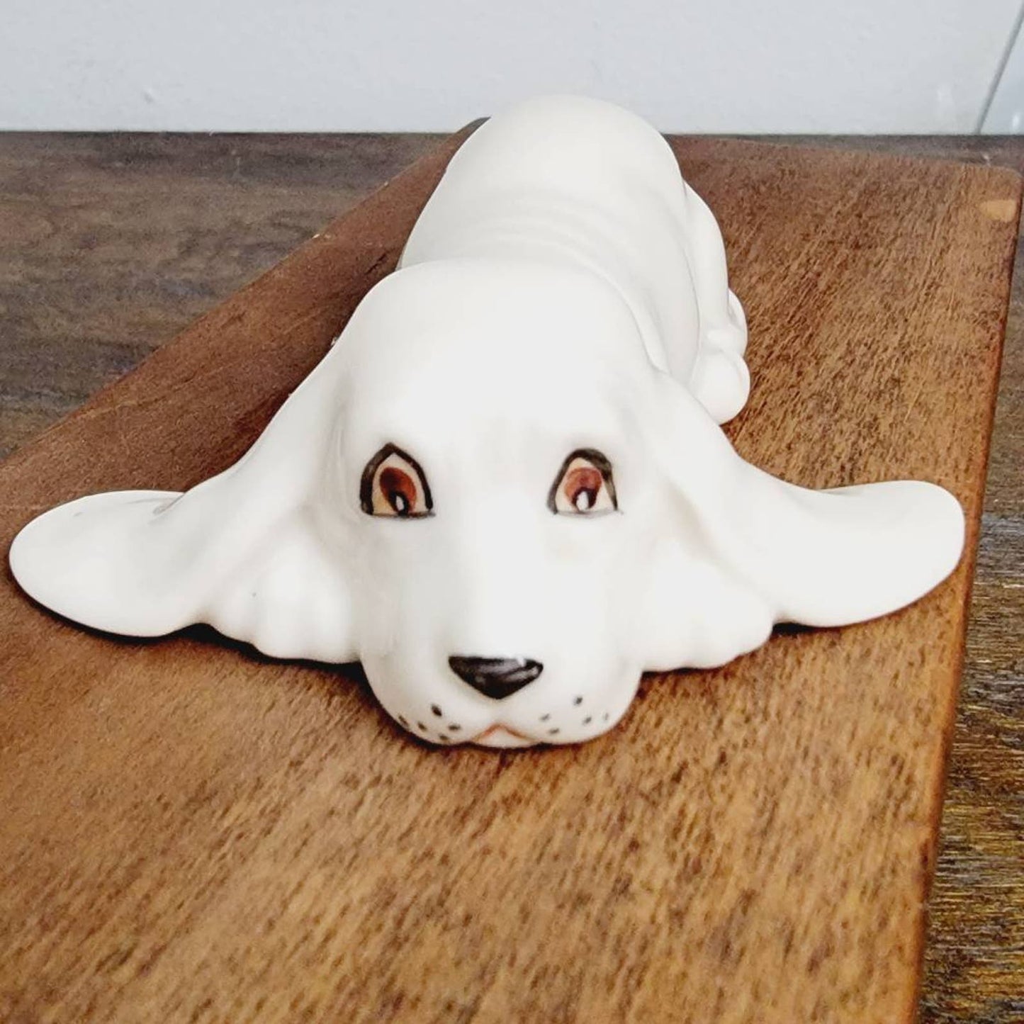 White Ceramic Hound Dog Figurine SDAC Hand Painted Eyes Nicola Lying Down 3.5"