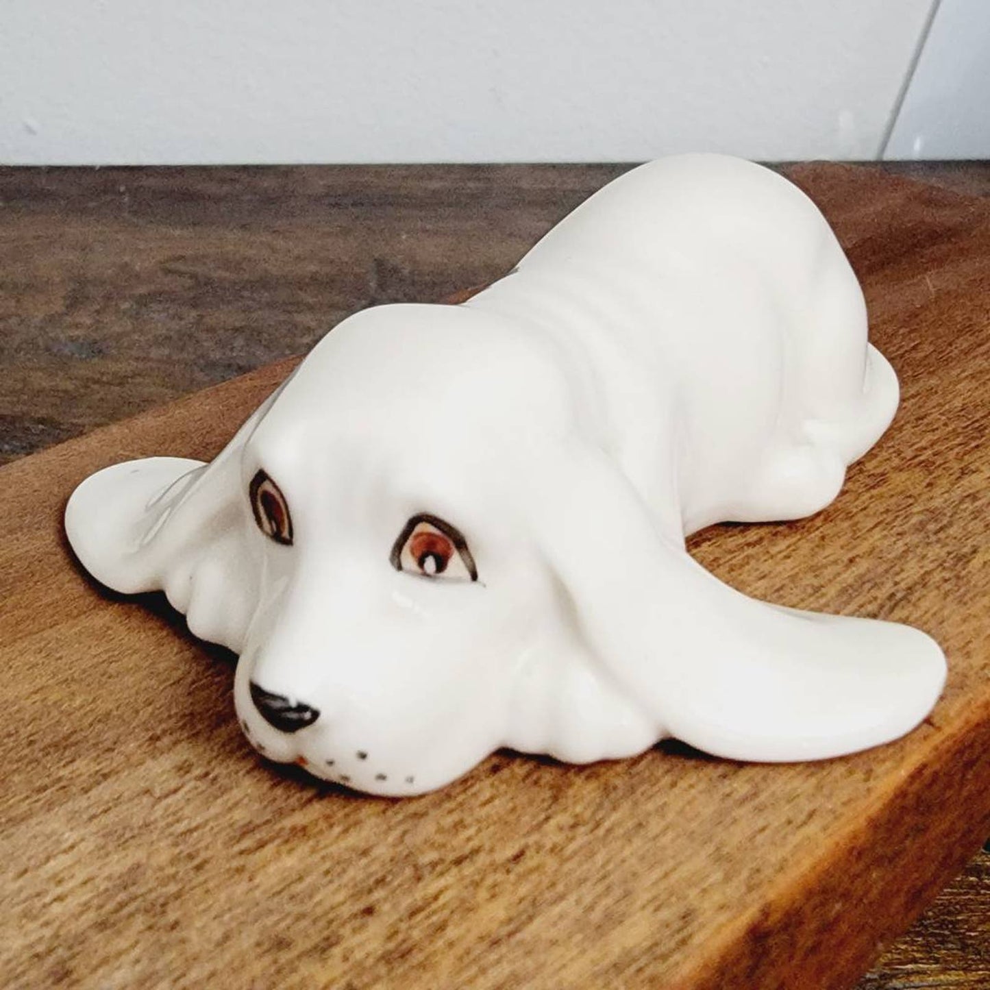 White Ceramic Hound Dog Figurine SDAC Hand Painted Eyes Nicola Lying Down 3.5"