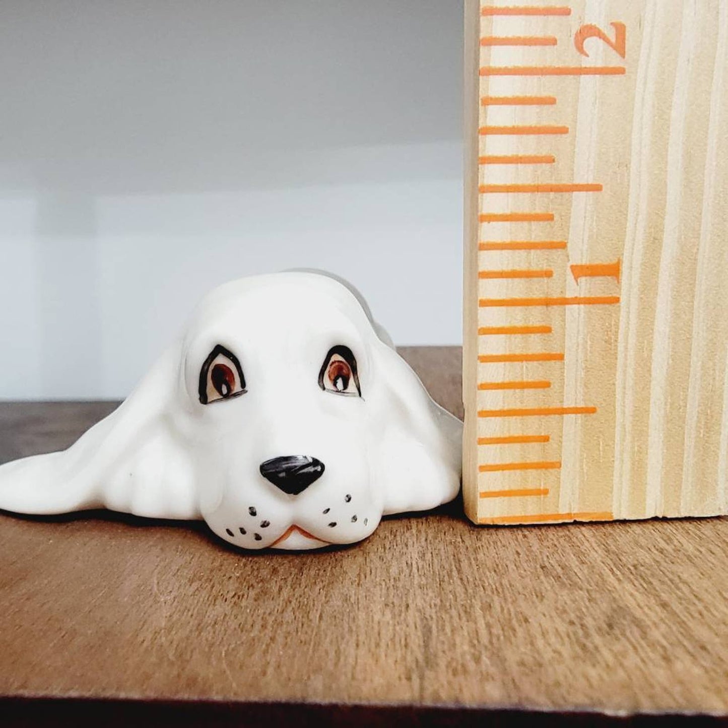 White Ceramic Hound Dog Figurine SDAC Hand Painted Eyes Nicola Lying Down 3.5"