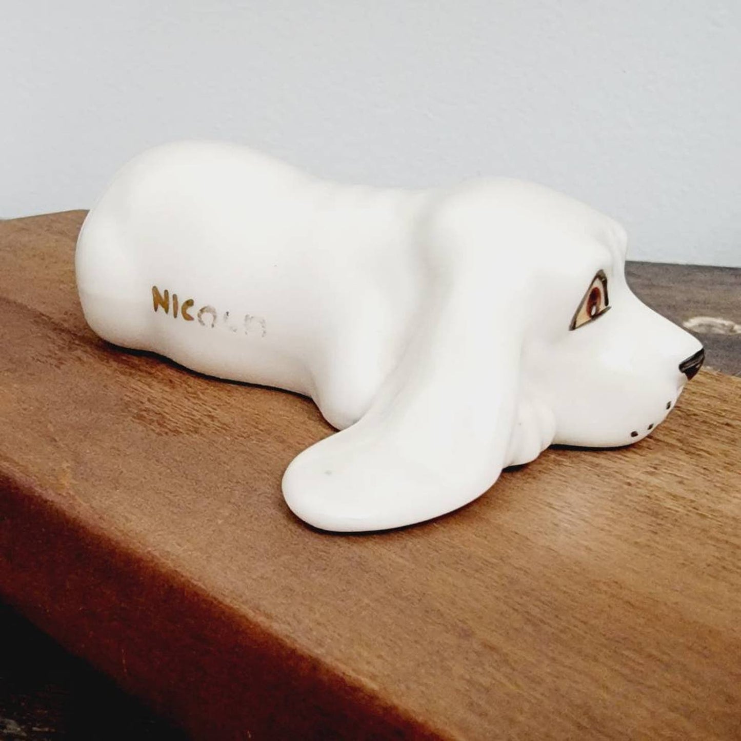 White Ceramic Hound Dog Figurine SDAC Hand Painted Eyes Nicola Lying Down 3.5"